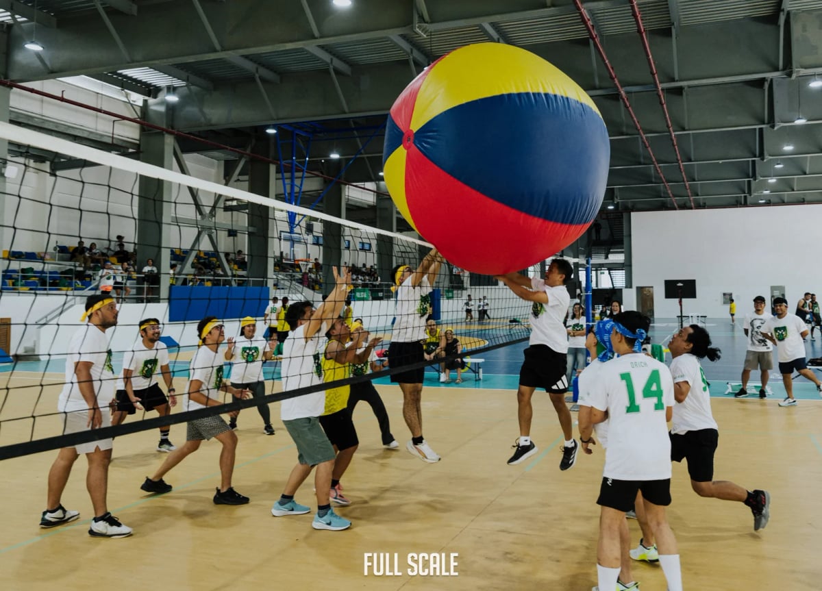 Full Scale employees playing giant beach ball volleyball during Sports Fest