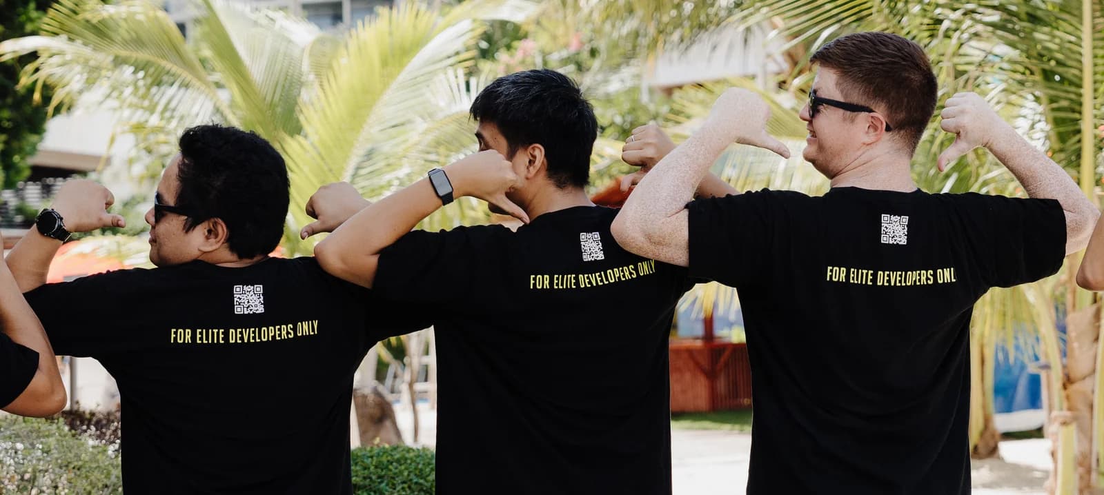 Full Scale engineers in company shirts that read For Elite Developers Only, each pointing at himself