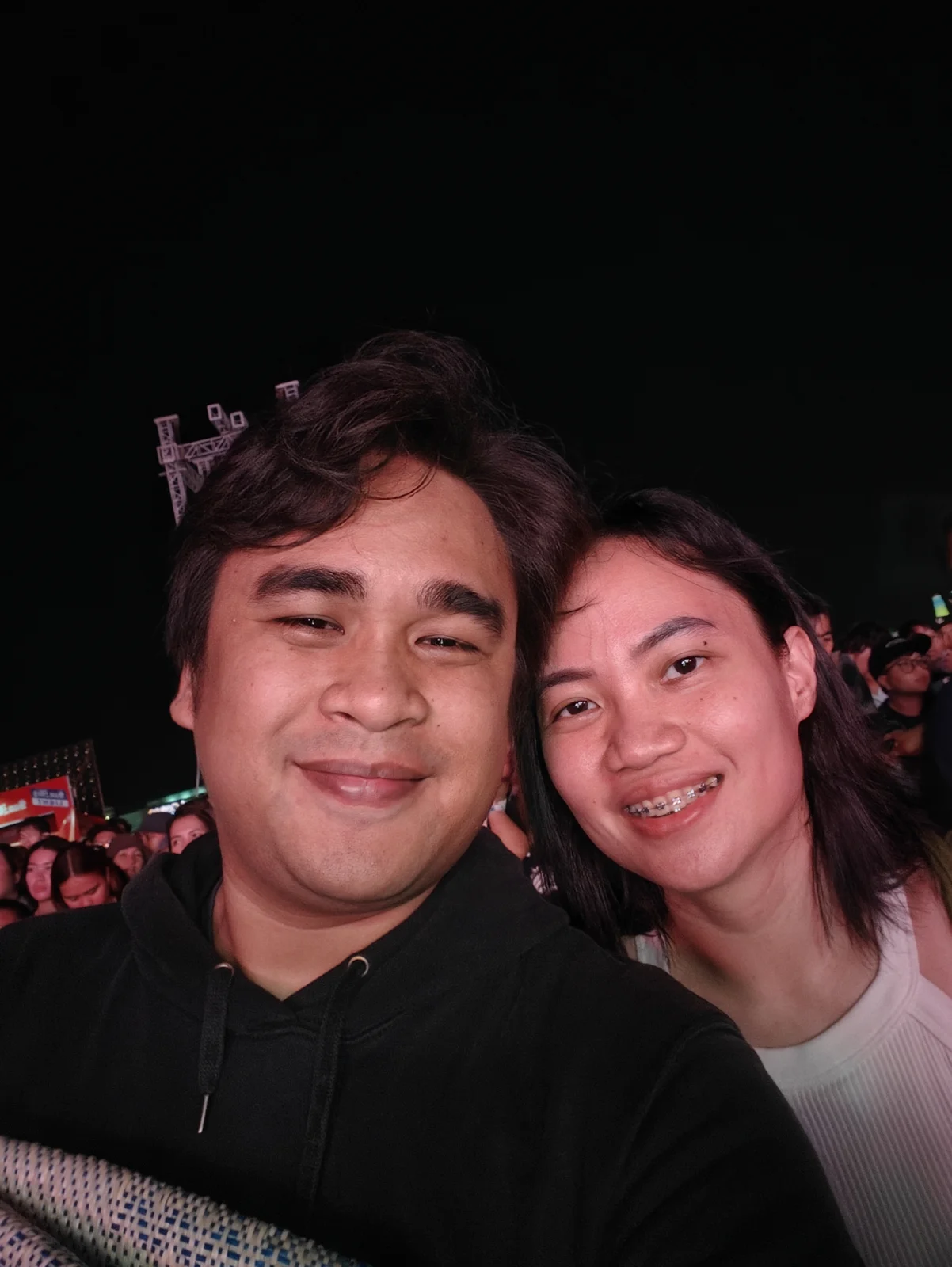 Two Full Scale employees together at Aurora Music Fest at night