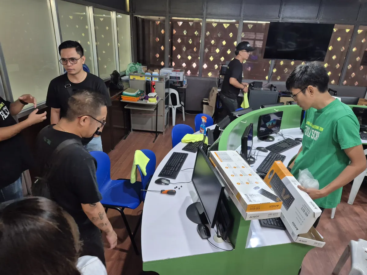 Full Scale volunteers servicing computers in the Learning Lab
