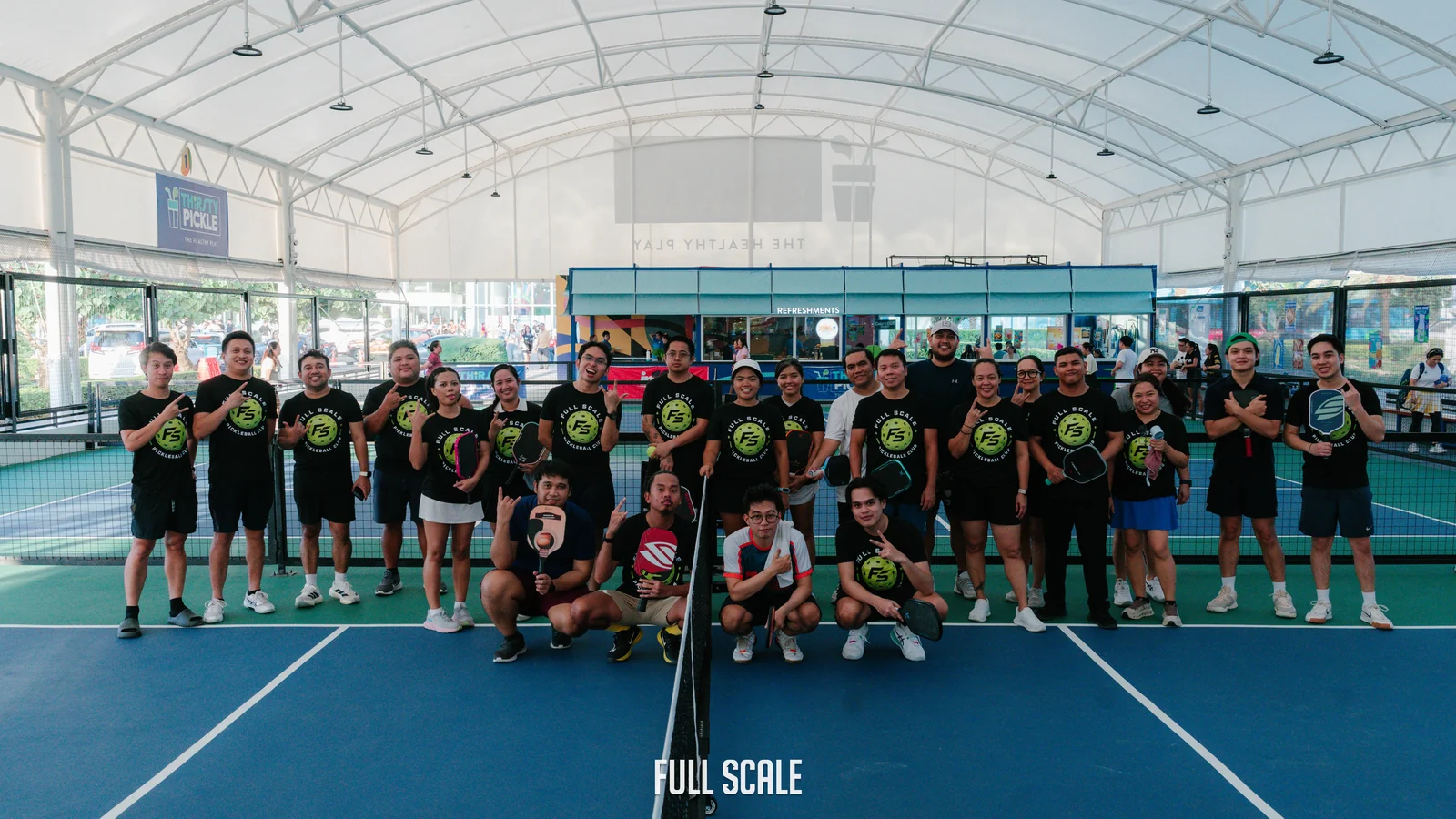 The Full Scale pickleball club on court in branded shirts